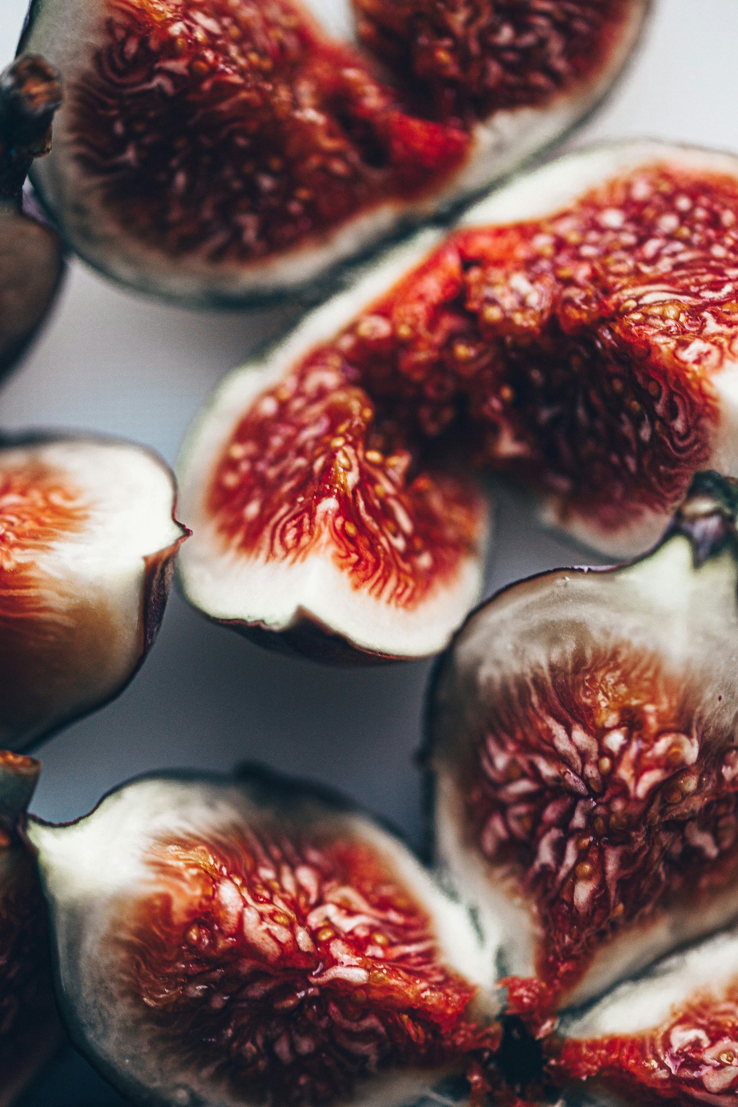 Almond fig smoothie image with fresh figs in a bowl in the background. The Sahajan logo is in the upper left corner. 